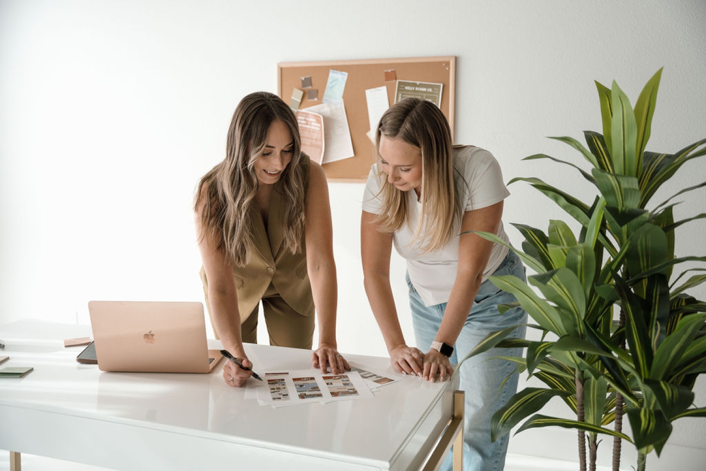 A brand and web designer in a studio discussing the sales journey